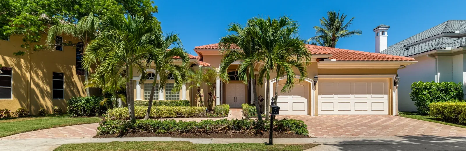 Florida house with palm trees in front yard